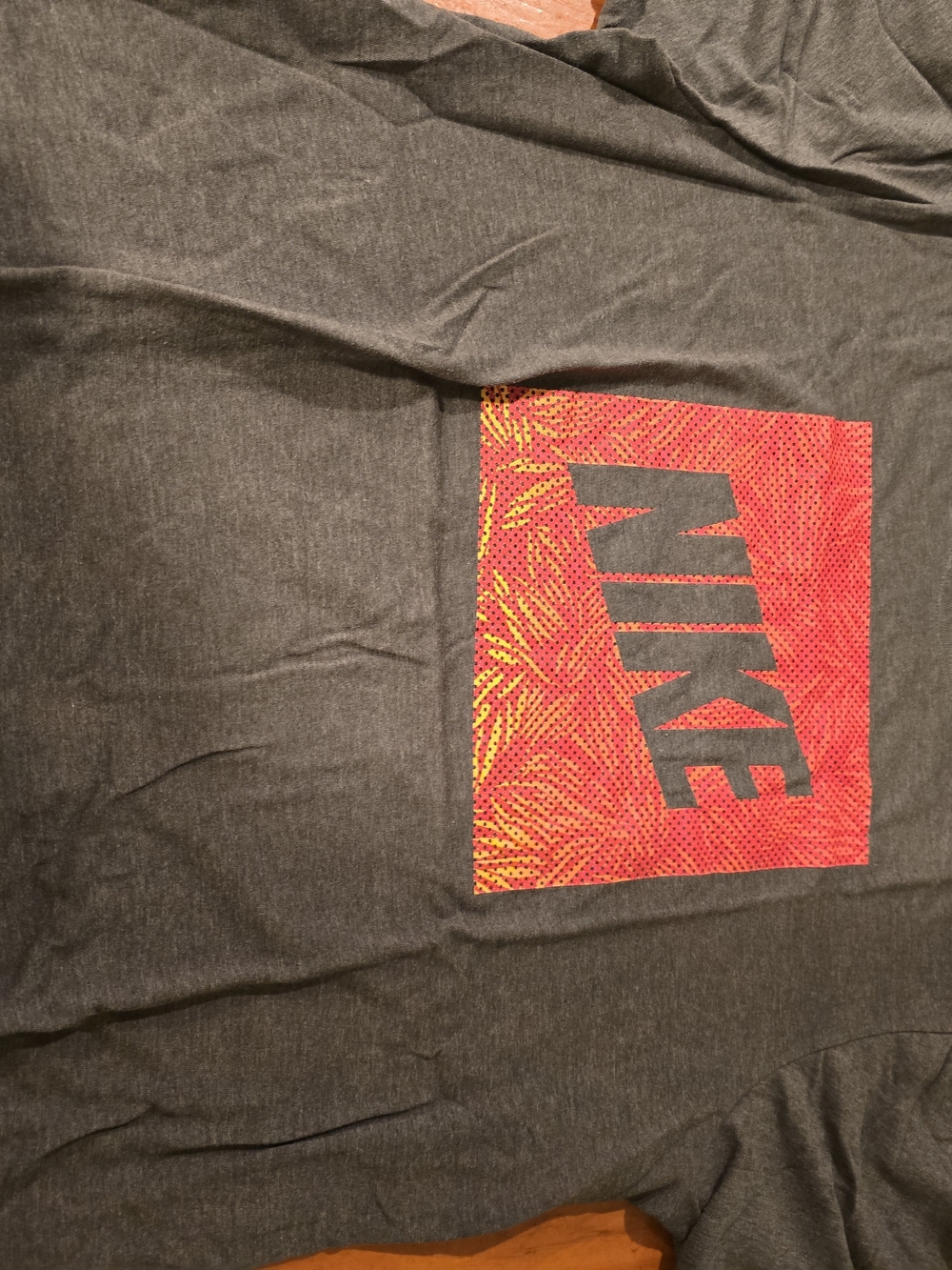 Nike Charcoal Crew Neck Tee with Red Graphic Detail